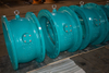 Titling check valve Hydraulically actuated slow-closing check valves with weights